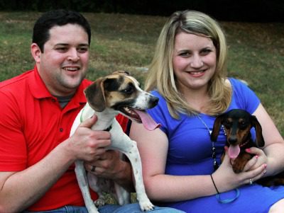 Adoptive parents Colby and Sarah with their dogs