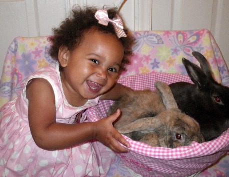 Image of Katie with bunnies from Roger and Tricia's Lifetime Adoption story