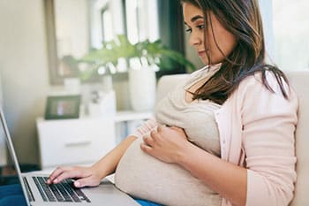 pregnant woman reading our award winning blog